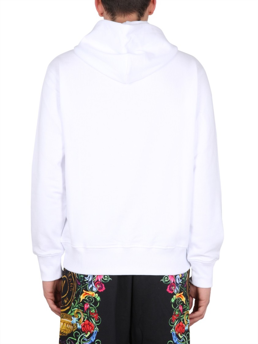 Shop Versace Jeans Couture Drawstring Hooded Sweatshirt With Floral Logo Print In White