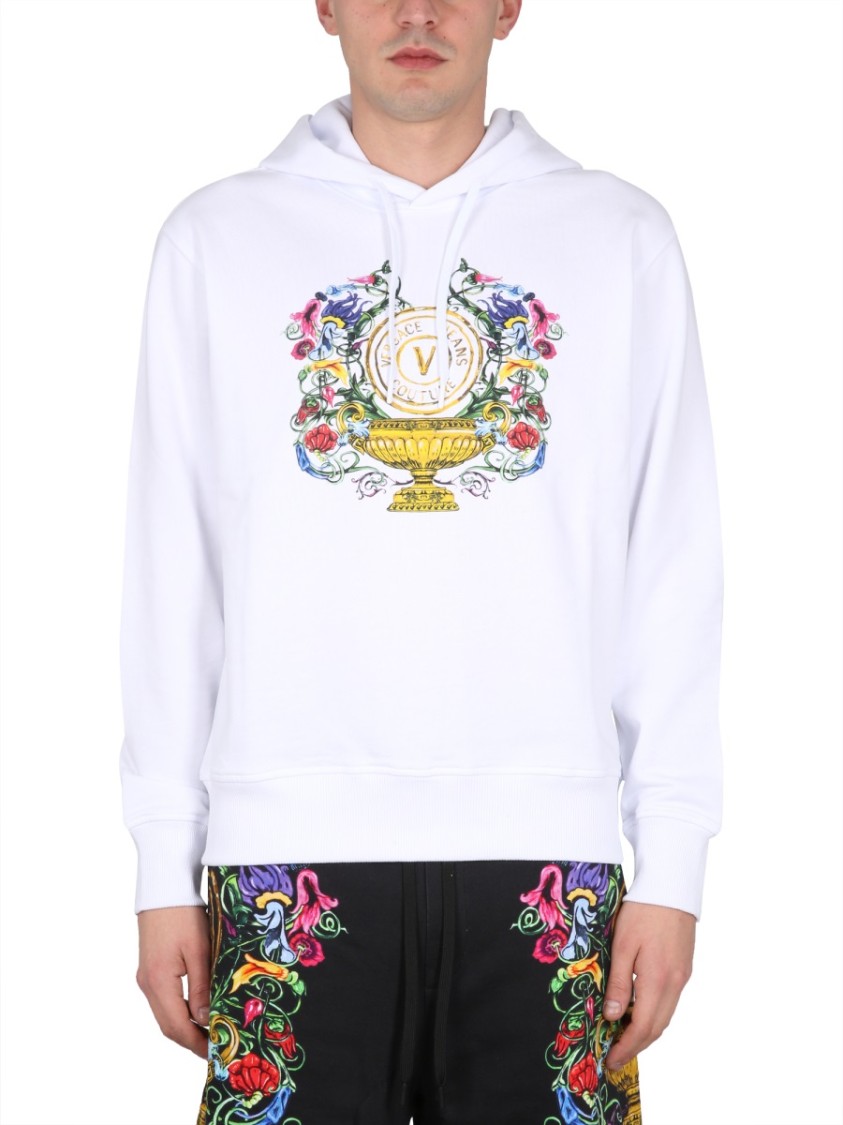 Shop Versace Jeans Couture Drawstring Hooded Sweatshirt With Floral Logo Print In White