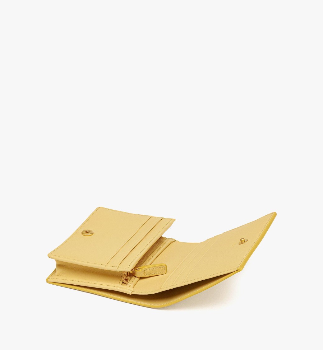 Mcm Embossed Leather Wallet With Noble Wreath Motif In Gold