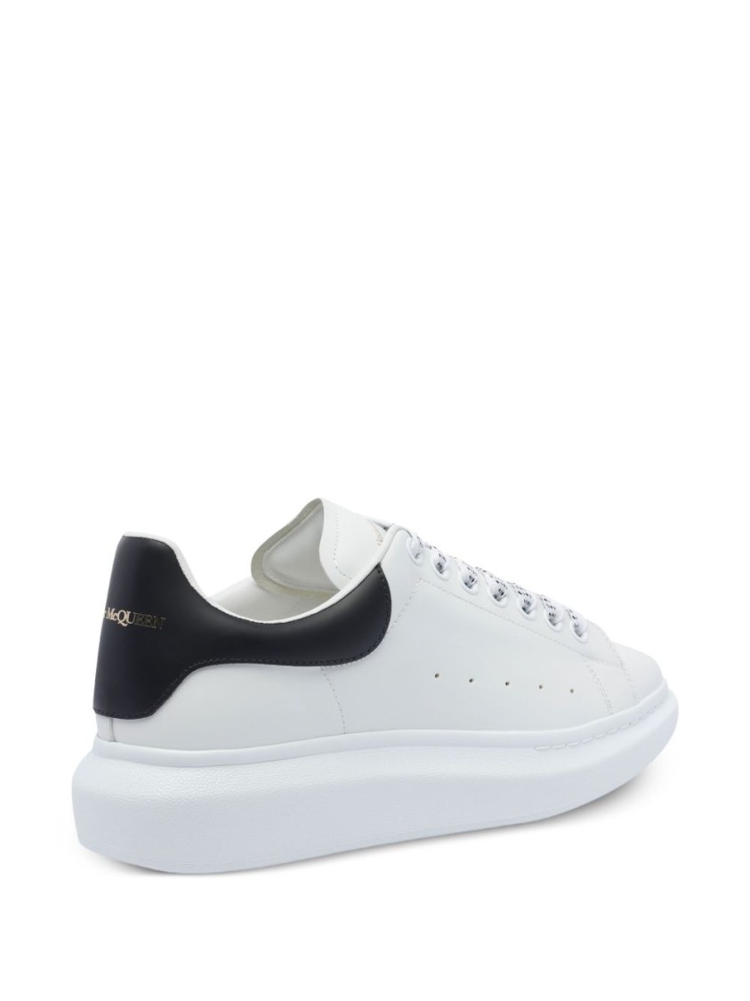 Alexander Mcqueen Minimalist White Leather Sneakers With Contrasting Heel Tab In White